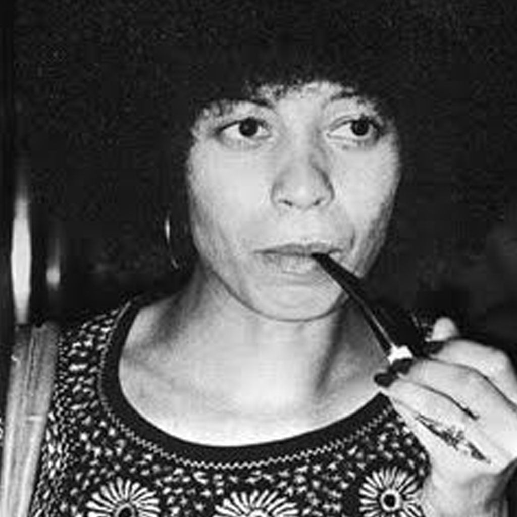 Political activist Angela Davis smoking a pipe